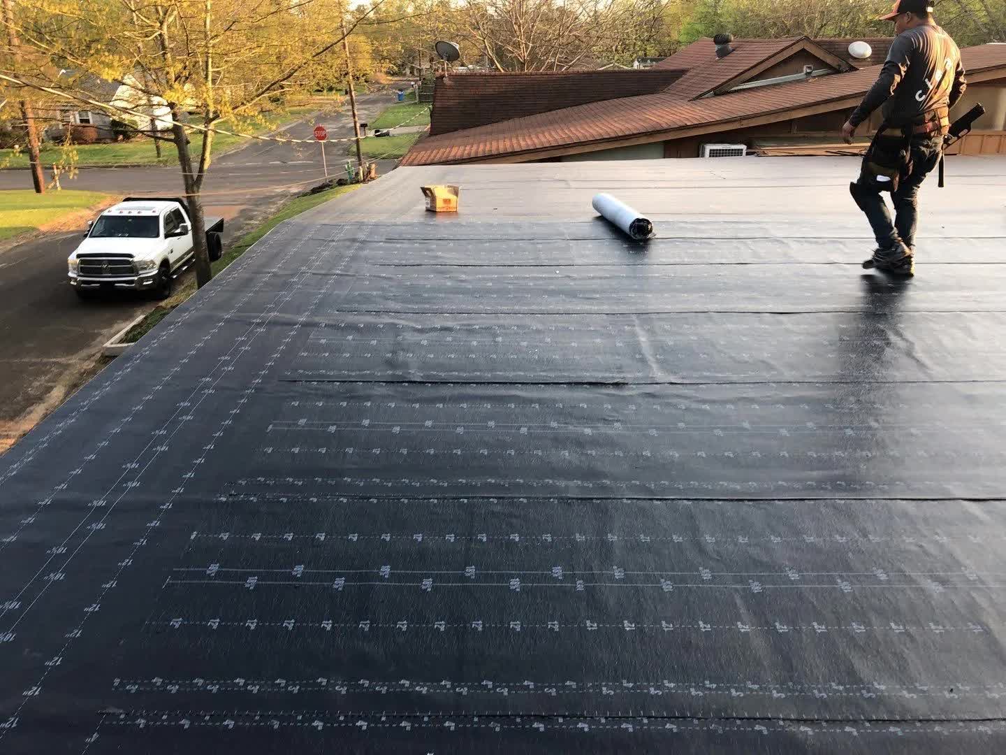 Wide commercial flat roof under a clear sky